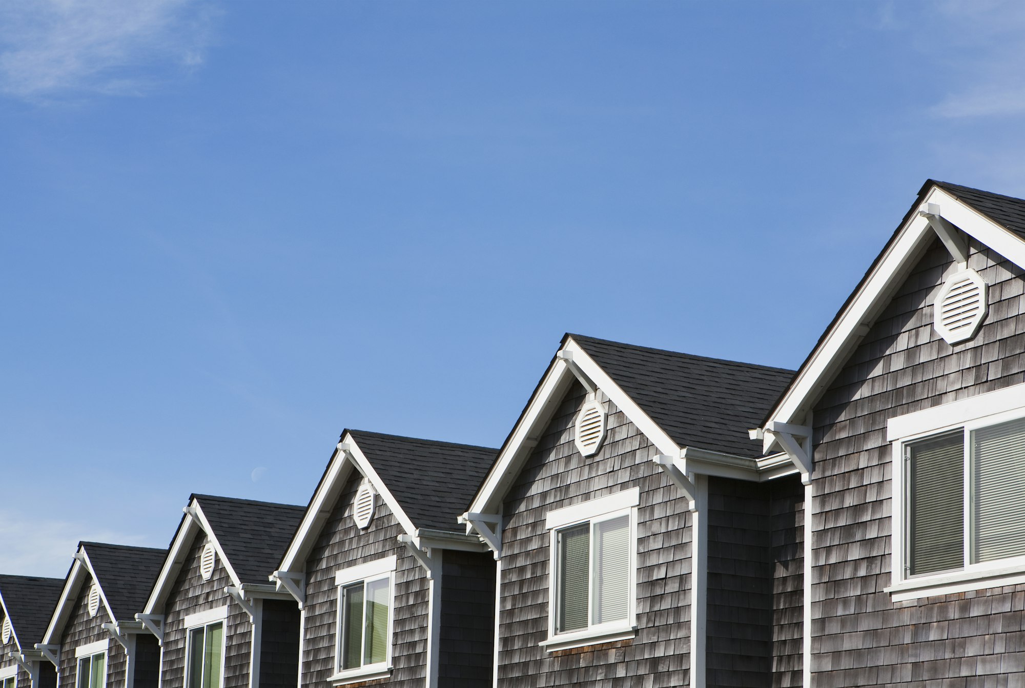 Row of houses, all the same, pitched roof and upstairs window